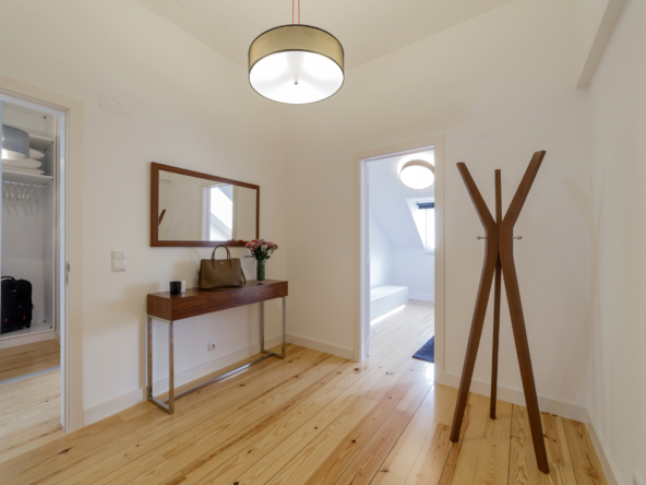 Modern apartment with white walls and light wooden floor